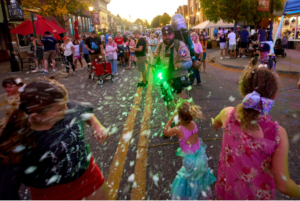 Street festival with foam and costumed performer